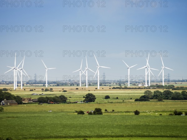An image of some modern wind energy in the scenery