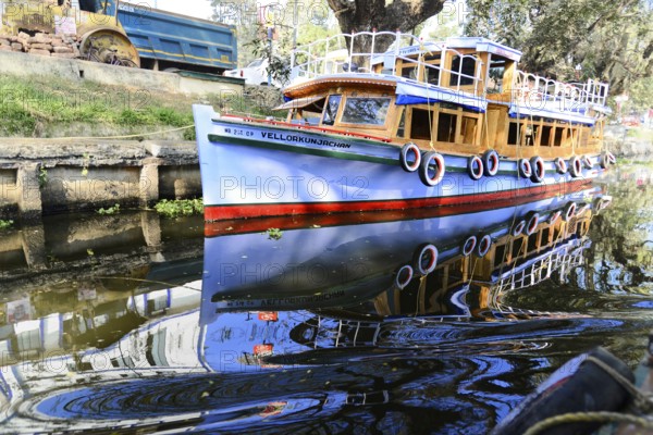 Fort Cochin, Cochin, Kerala, South India, India, Asia, Blue traditional boat reflected in the calm