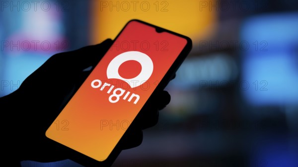 Origin Energy logo is displayed on smartphone. Origin Energy Ltd is an Australian energy company