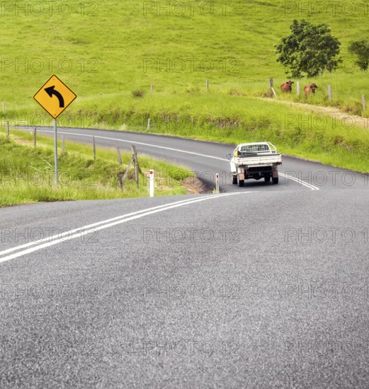 A photography of a road sign curve