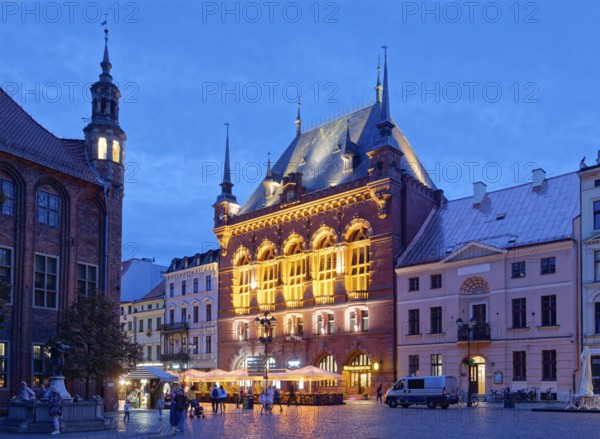 The Areszt sledczy in the medieval old town of Thorn, illuminated in the evening. The historic city