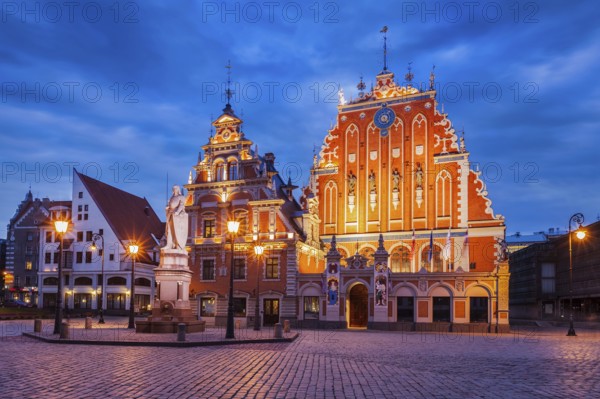 Riga Town Hall Square, House of the Blackheads and St. Roland Statue illuminated in the evening