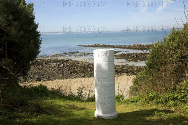 White marker post by sandy beach, Island of Herm, Channel Islands, Great Britain