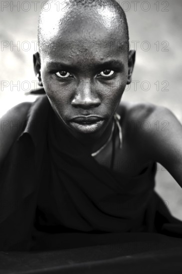 Portrait of a teenage boy from the Njemps tribe, Kenya. He is following his initiation rite. Once