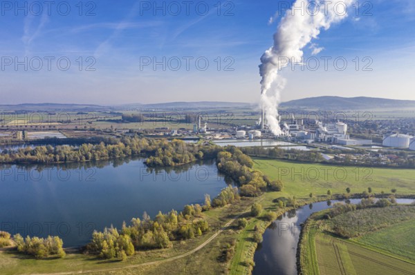 Drone shot of river Leine with Nordzucker sugar factory in Nordstemmen, smoking chimneys on a cold