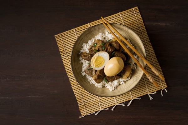 Stewed eggs, with pork belly, and rice, chinese food, homemade, selective focus, rustic, no people