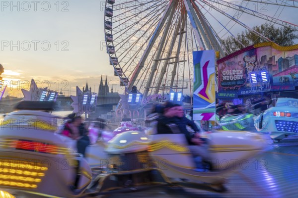 Deutz funfair on the Rhine, at Easter, funfair, break-dancer ride, Ferris wheel, Cologne Cathedral,