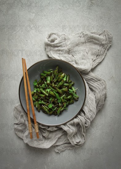 Fried bean pods, in soy sauce, with sesame seeds, homemade, no people