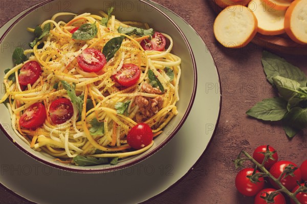 Yellow zucchini salad, with cherry, vegetarian food, sliced into strips, homemade