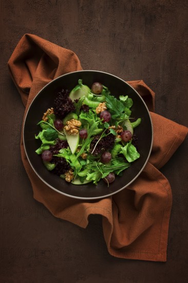 Fresh salad, waldorf, celery stalk, with apple and walnut, grapes, herbs, homemade, no people