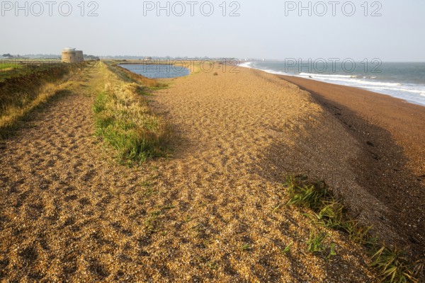 North Sea coastline view of shingle ridge and lagoon on beach bar, Shingle Street, East Lane,