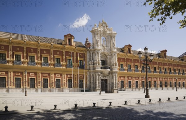 San Telmo palace building facade with columns at the entrance decorated with carved statues and