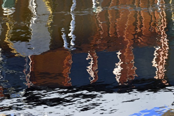Reflection, colourful reflections on the water surface, maritime impressions, Greetsiel, North Sea,