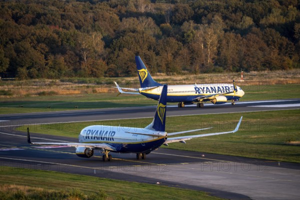 Ryanair Boeing 737 taxis to the runway, another Ryanair aircraft taxis for take-off, Cologne-Bonn