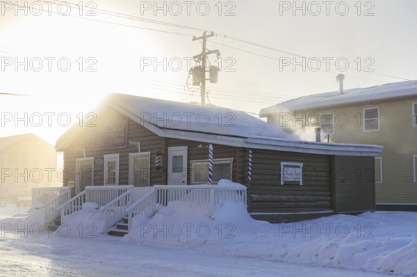 Historic building, fog, ice fog, snow, winter, cold, sun, smoke, Dawson City, Yukon, Canada, North