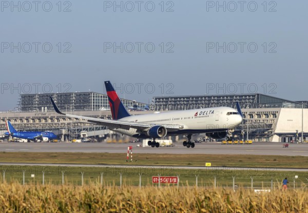 Stuttgart Airport with terminal, Delta Air Lines aircraft landing. Boeing 767-300. Stuttgart