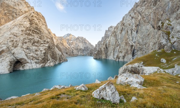 Turquoise mountain lake Kol Suu with rocky steep mountains, Kol Suu Lake, Sary Beles Mountains,