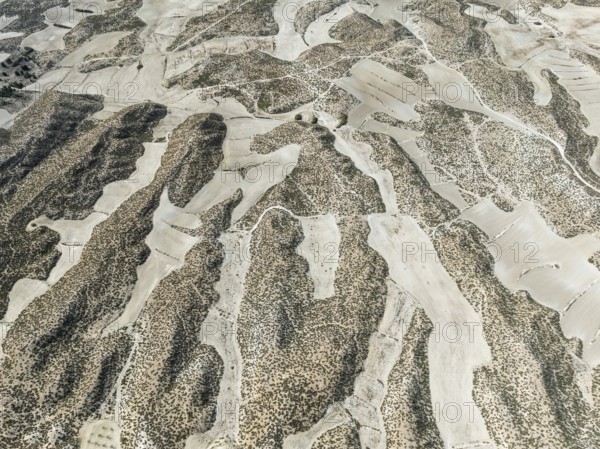 Farmland amongst rocky outcrops. Aerial view. Drone shot. Granada province, Andalusia, Spain,
