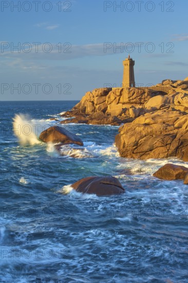 Lighthouse, Phare de Mean Ruz or Phare de Ploumanach, in the foreground rocky coastal landscape,