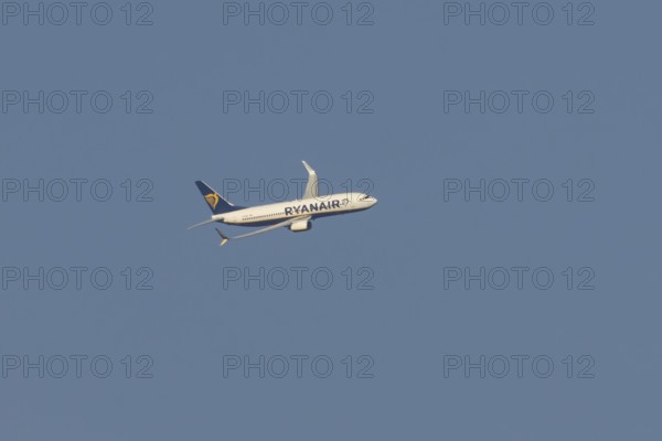 Boeing 737 jet passenger aircraft of Ryanair flying in a blue sky, Rome, Italy, Europe