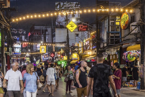 Crowds of people on Bangla Street in the evening. Nightlife on Bangla Walking Street with go-go