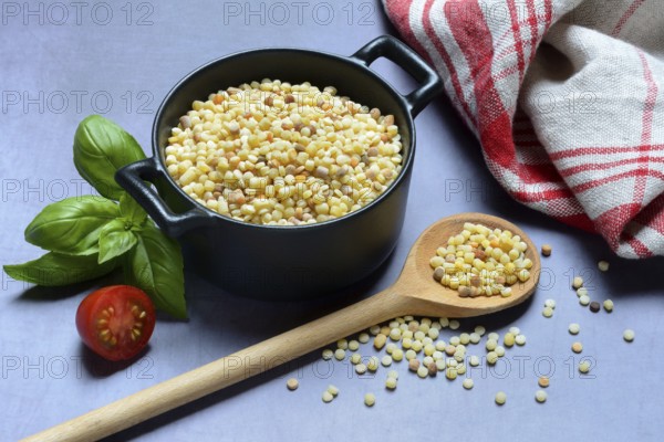 Fregola in pots and spoons, uncooked, pasta variety from Sardinia, Italy, Europe