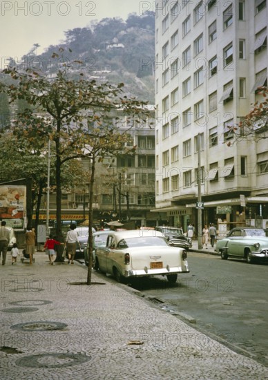 Streets, shops, parked cars in Copacabana, Rio de Janeiro, Brazil 1962 Shantytown Favela on a