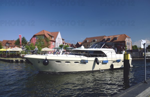 Europe, Germany, Mecklenburg-Western Pomerania, island town of Malchow, Lake Malchow, jetty, motor