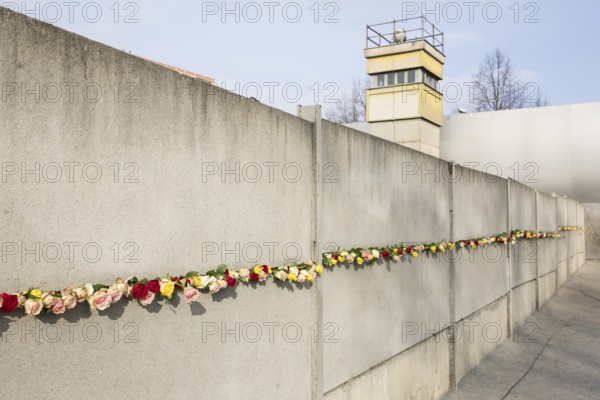 The Wall decorated with roses at the central commemorative event at the Berlin Wall Memorial to