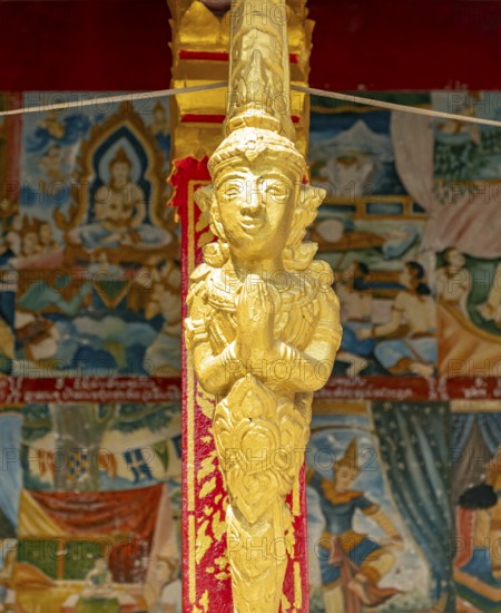 Gilded deity statue, Wat Phonxay, Luang Prabang, Laos, Asia