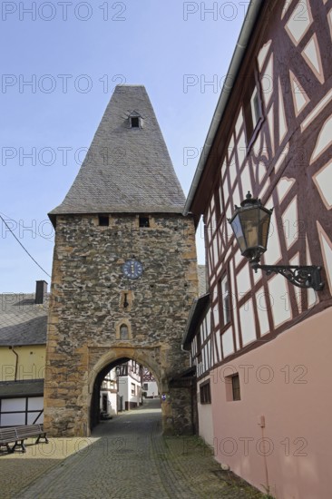 Historic clock tower and landmark, town gate, town tower, street lamp, Herrstein, Hunsrück,