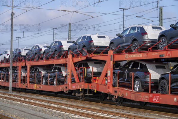 Car train, goods train on its way to the car terminal in Bremerhaven seaport, new German cars for
