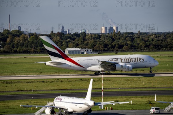 Düsseldorf Airport, Emirates Airbus A380-800 taking off, in the background the HKM steelworks in