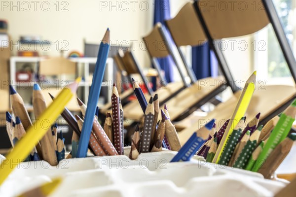 Classroom of a fourth grade, after school, the building is older but in good condition, coloured