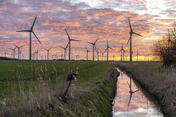 Wind farm near the East Frisian town of Norden, east of the town, sunset, Lower Saxony, Germany,