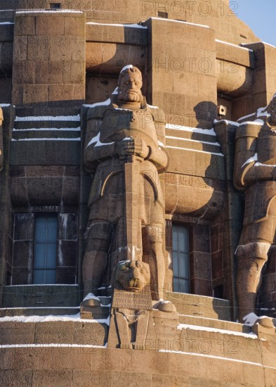 Guardian figures, Völkerschlachtdenkmal on a winter's day with snow, Leipzig, Saxony, Germany,