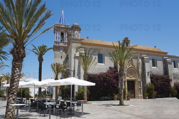Historic church with palm trees in a sunny setting, Parroquia de Nuestra Señora de la O, Parish of