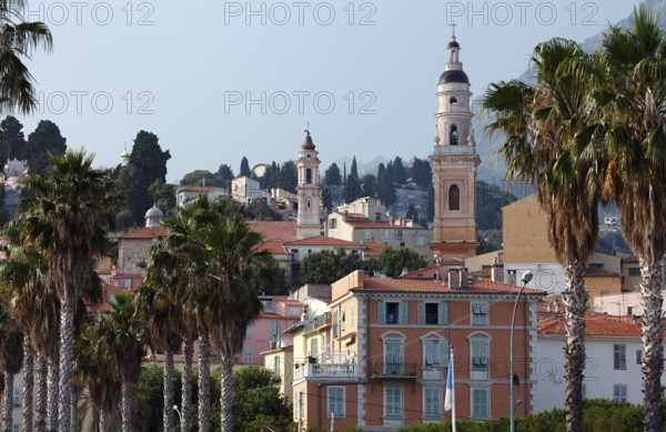 The town of Menton reflected in the sea, Menton, Côte d'Azur, Provence, France, Europe