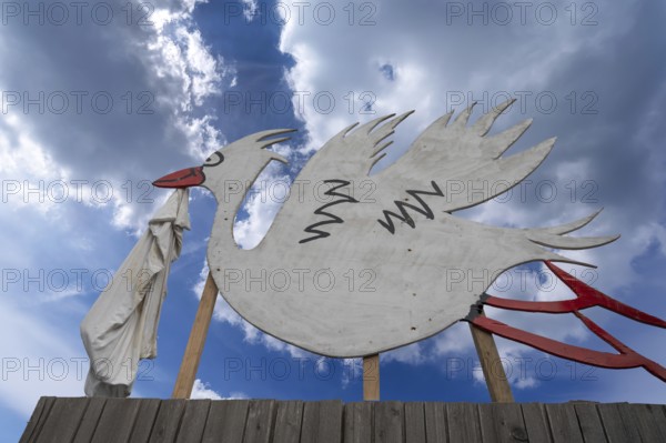 Stork figure with nappy announces the birth of a child, widespread tradition, Schärding, Lower
