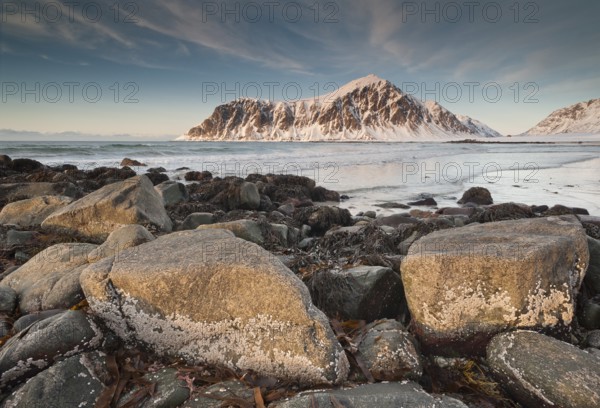 Winter evening mood at Skagsanden, rocks and beach near Flakstad, Flakstadøy, Lofoten, Nordland,