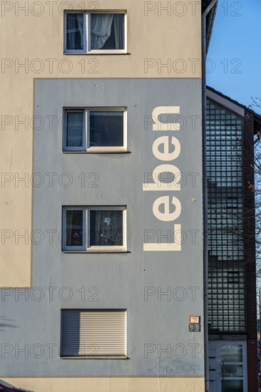 Residential buildings, rented flat, façade with the inscription Leben, on Adolf-Schmidt-Strasse,