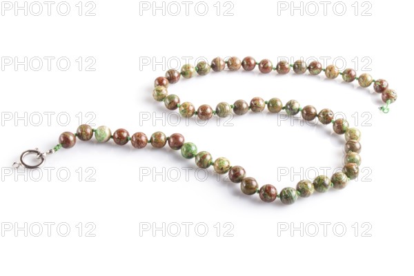 Colored onyx beads isolated on white background. top view, close up