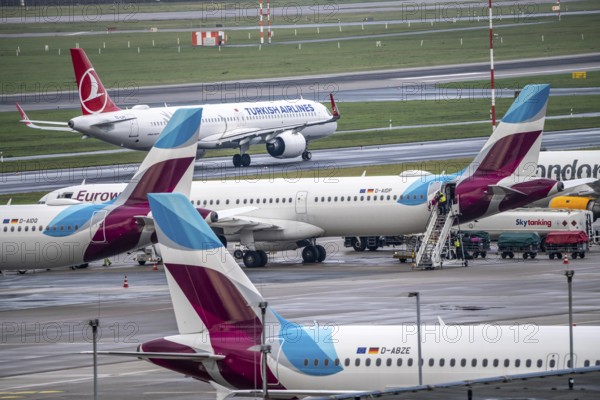 Düsseldorf Airport, Eurowings aircraft on the apron, Turkish Airlines Airbus on the taxiway for