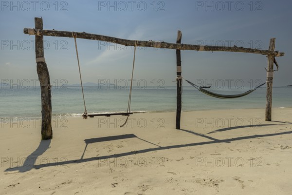 Swing and hammock on the beach of Koh Mook Island, Andaman Sea, Satun Province, Southern Thailand,