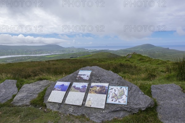 Signposts to the Skellig Rocks lying in the haze on the horizon, County Kerry, Republic of Ireland