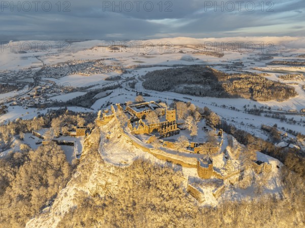 Aerial view of the snow-covered Hegau volcano Hohentwiel with Germany's largest castle ruins on a