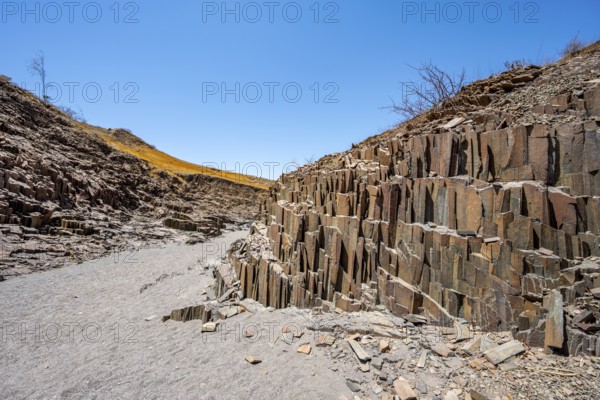 Dry river valley with basalt rocks, rock formation Organ Pipes, Damaraland, Kunene, Namibia, Africa