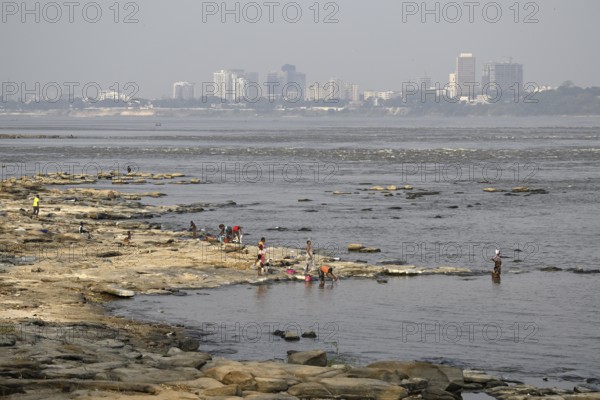 Women washing their laundry at the Congo River near the Malebo pool, formerly Stanley pool,