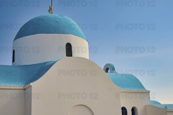 Side view of a white-blue church under a blue sky, Church of Profitis Ilias, above Nikia, Nikia,