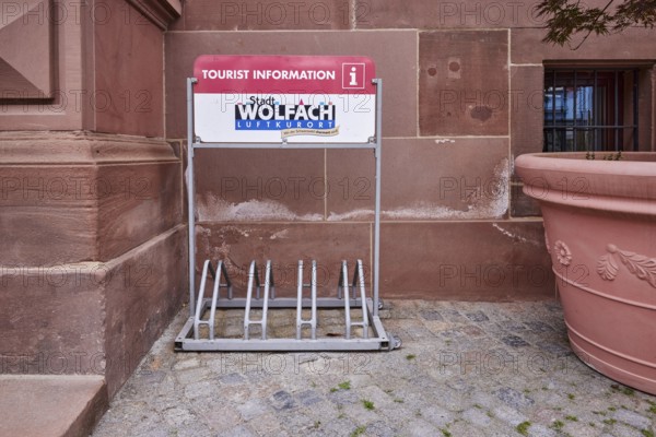 Bicycle stand with advertising City of Wolfach, tourist information centre, flower bucket, main